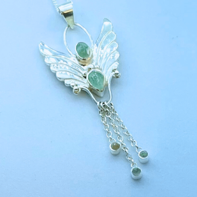 beautiful green tourmaline gemstones in a angel pendant